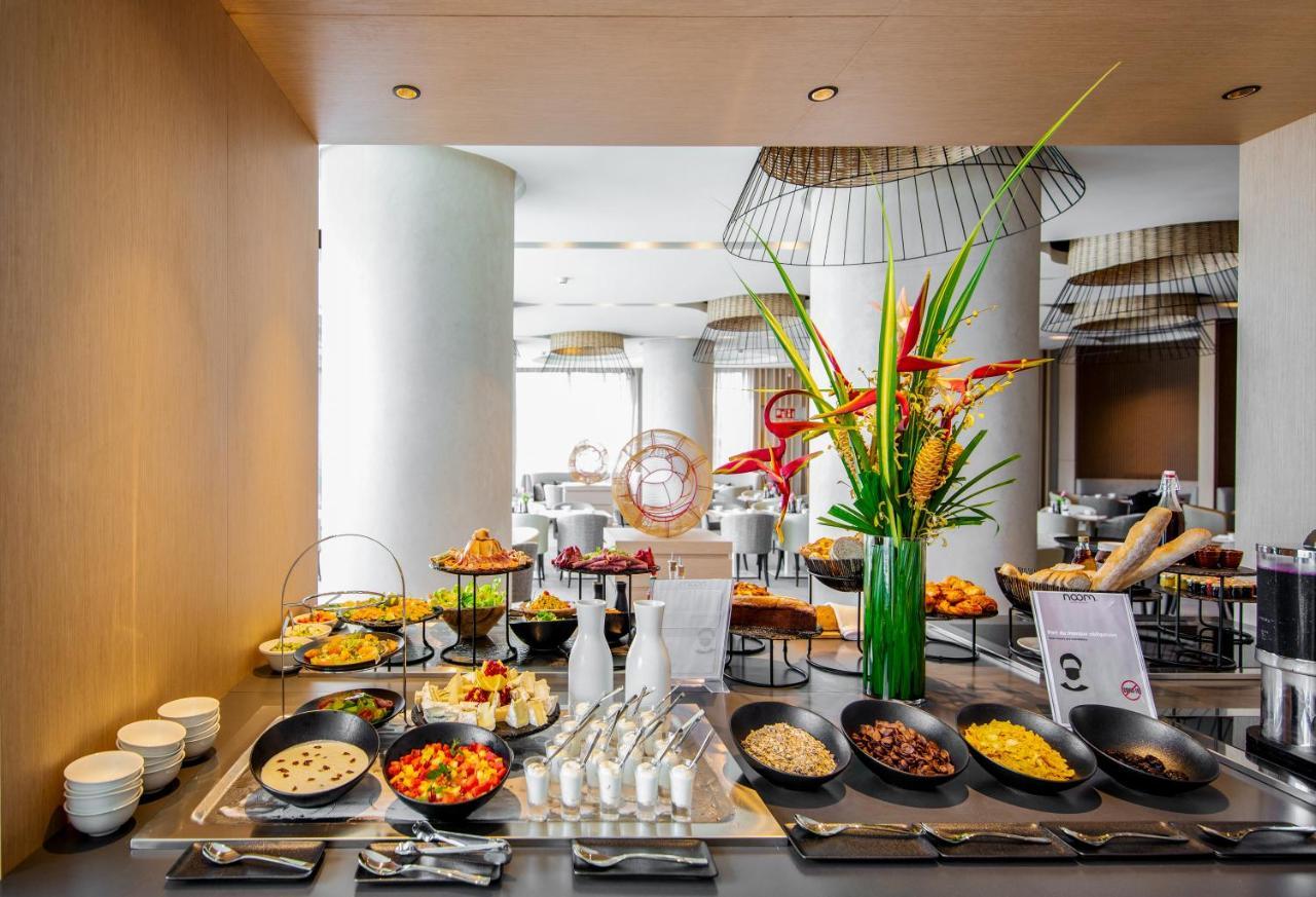 Noom Hotel Abidjan Plateau Exterior photo A buffet at a hotel
