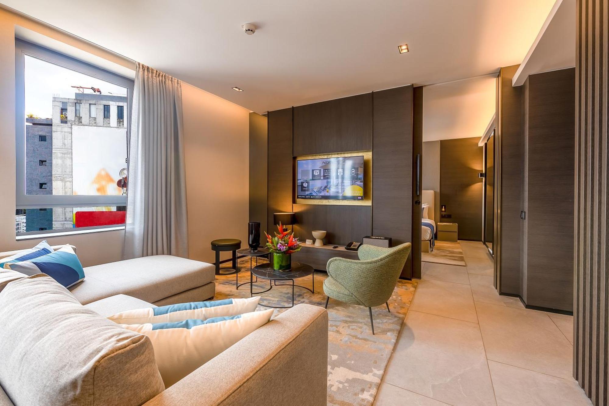 Noom Hotel Abidjan Plateau Exterior photo The living room of a suite at the Mandarin Oriental